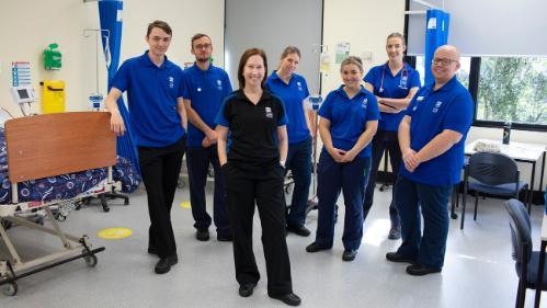 UOW College Nursing student with trainer