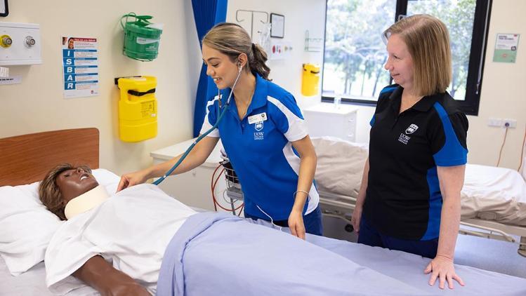 UOW College Nursing student in sim lab